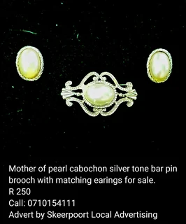 Mother of pearl cabochon silver tone bar pin brooch with matching earings for sale.