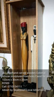 2x large hand carved wooden colonial African sculptures from ivory coast for sale.