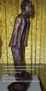 Vintage large and solid hand carved African wooden sculptures for sale
