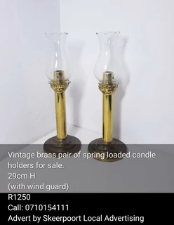 Vintage brass pair spring loaded candle holders for sale