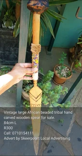 Vintage large African beaded tribal hand carved wooden spear for sale.