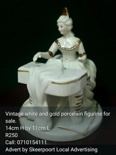 Vintage whiteand gold porcelain musical fugirine for sale