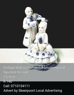 Vintage whiteand gold porcelain musical fugirine for sale