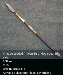 Vintage African Zulu double sided mask Iklwa spear for sale.