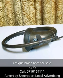 Antique brass horn for sale.