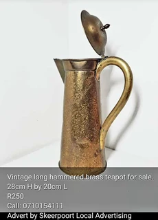Vintage long hammered brass tea pot for sale.