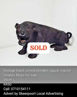 Signed Charles Moyo,carved wooden jaguar for sale