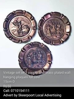 Vintage set of 3 copper and brass wall hanging plaques  for sale.