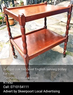 Antique oak two tier English serving trolley for sale.