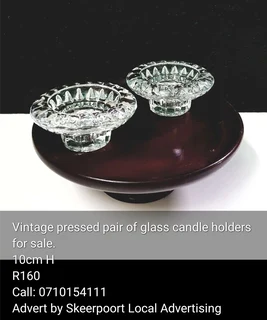 Vintage pressed pair of glass candle holders for sale.