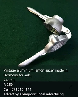 Vintage aluminium lemon juicer made in Germany for sale.