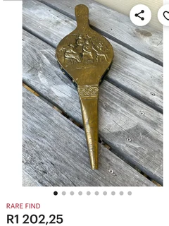 Vintage carvred brass fireplace bellows made in England for sale.