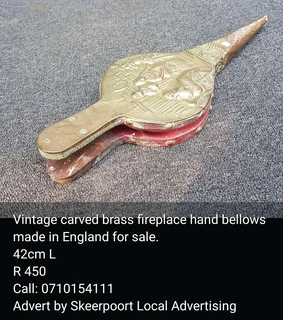 Vintage carvred brass fireplace bellows made in England for sale.