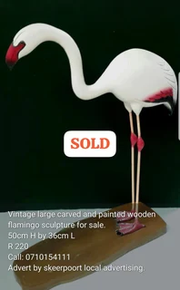 Vintage large carved and painted wooden flamingo sculpture for sale.