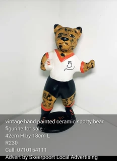 Vintage hand painted ceramic sporty bear for sale.
