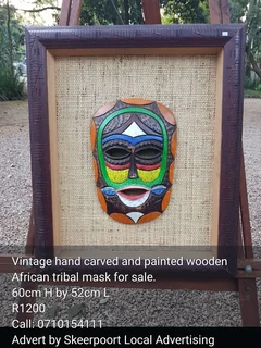 Vintage hand painted and carved wooden African tribal mask for sale.