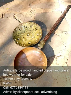 Antique large wood handled copper and brass bed warmer for sale.