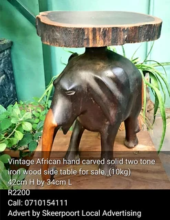 Vintage African hand carved solid 10kg two tone iron wood side table for sale.
