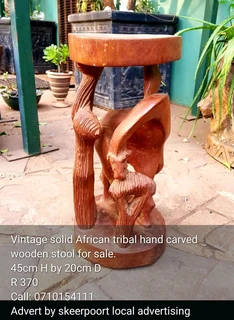 Vintage solid African tribal hand carved wooden stool for sale.