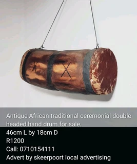 Antiques African traditional ceremonial double headed hand drum for sale.