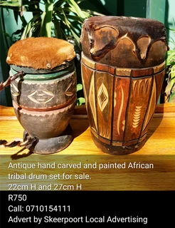 Antique carved and painted Africa tribal drum set for sale.