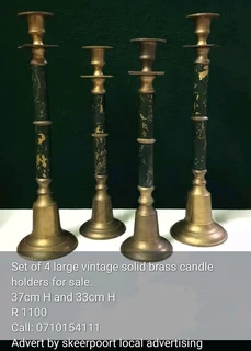 Set of 4 large vintage solid brass candle holders for sale.