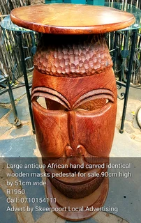 Extra large African carved mask cocktail pedestal for sale.