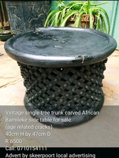 Vintage single tree trunk African Bamileke side table for sale.