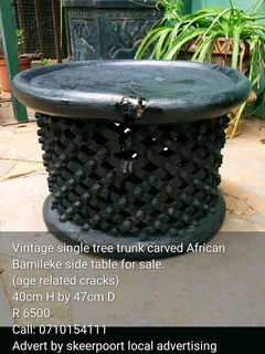 Vintage single tree trunk African Bamileke side table for sale.
