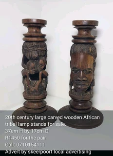 20th century large carved wooden African tribal lamp stands for sale.