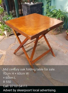 Mid century oak folding table for sale.