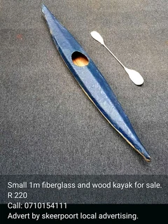 Small 1m fibreglass and wood kayak for sale