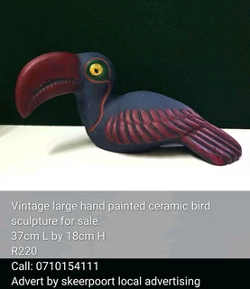 Vintage large hand painted ceramic bird sculpture for sale.