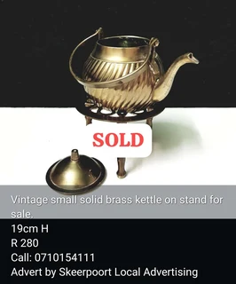 Vintage small brass kettle on stand for sale.
