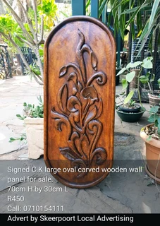 Signed wooden wall panels for sale.