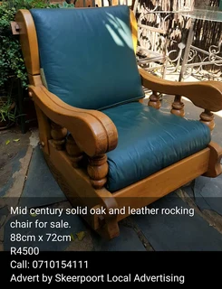 Mid century solid oak and leather rocking chair for sale.