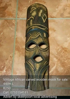 Vintage African carved wooden mask for sale.