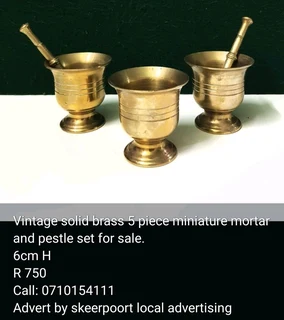 Vintage solid brass 5 piece miniature mortar and pestle set for sale.