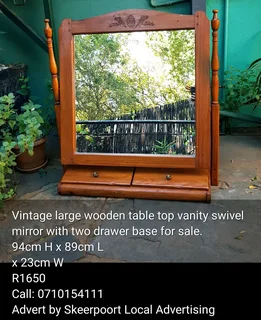 Vintage large wooden tabel top vanity swivel  mirror with two drawer base for sale.