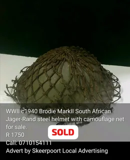 Pair of vintage 1979s SANDF m63 helmets for sale.