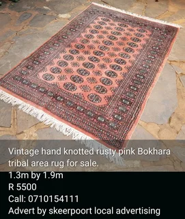 Vintage hand knotted rusty pink Bokhara tribal area rug for sale