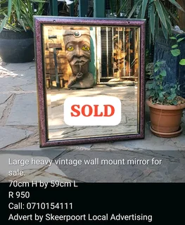 Large heavy vintage wall mount mirror for sale.