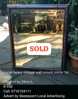Large heavy vintage wall mount mirror for sale.