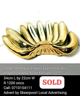 Large centerpiece brass plated banana shaped ceramic bowl for sale.