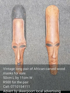 Vintage long pair of African wooden carved masks for sale