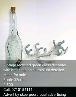 Vintage recycled green glass decanter with brass tap on aluminium detailed stand for sale