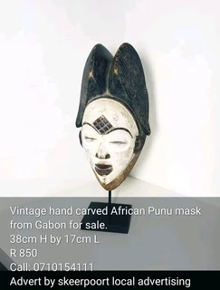 Vintage hand carved African punu mask from Gabon for sale