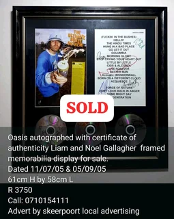 Oasis rock band autographed framed memorabilia display for sale.