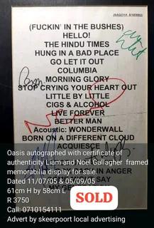 Oasis rock band autographed framed memorabilia display for sale.