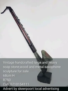 Vintage handcrafted large and heavy soap stone,wood and metal saxophone sculpture for sale